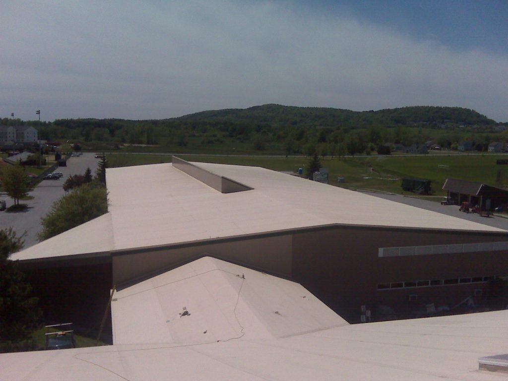 concrete roofing of a large building, white coloring